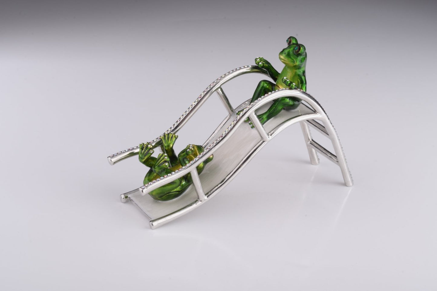 Two Frogs Riding Slide